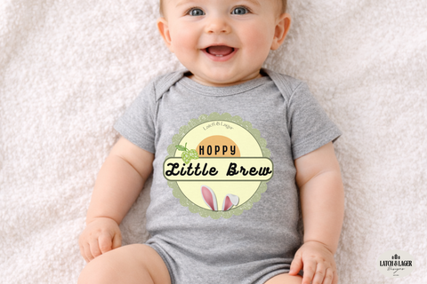 Baby wearing a gray onesie with a 'Hoppy Little Brew' design on a light background