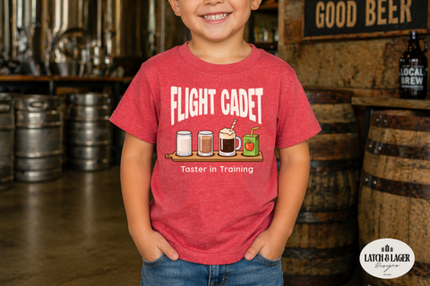 Child wearing a red 'Flight Cadet' t-shirt in a brewery setting