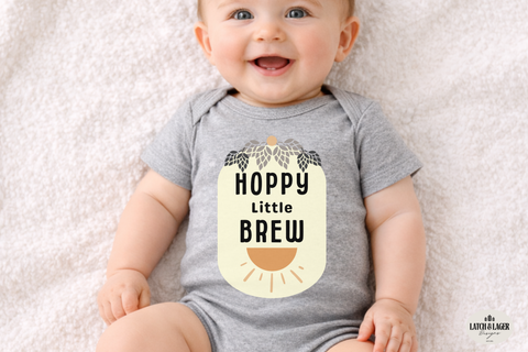 Baby wearing a gray onesie with 'Hoppy Little Brew' text on a light background