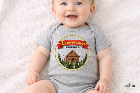 Baby wearing a gray onesie with a brewery logo on a light background