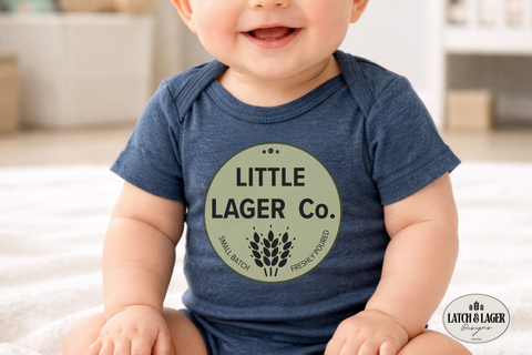 Baby wearing a blue onesie with 'Little Lager Co.' print