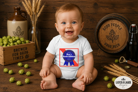 Baby wearing a onesie with a blue and red emblem, sitting on a wooden floor with beer-themed decor.