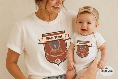 Woman and baby wearing matching t-shirts with 'Mom Stout' and 'Mini Stout' designs.