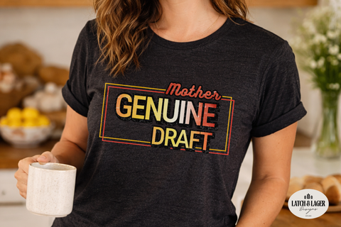 Person wearing a black t-shirt with 'Mother Genuine Draft' text, holding a mug in a kitchen setting.