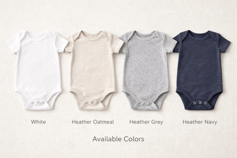 Four baby bodysuits in different colors on a light background