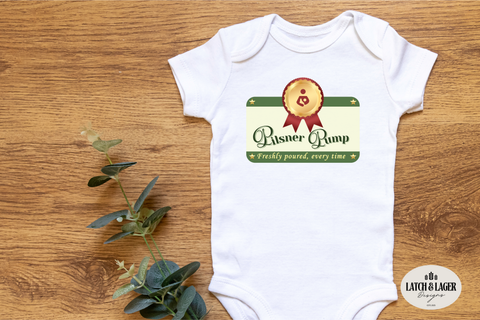 White baby onesie with a graphic design on a wooden surface