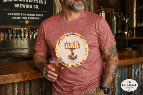 Man wearing a red t-shirt with a brewing company logo, holding a beer glass in a bar setting.